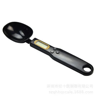 White digital spoon kitchen scale with LCD display showing weight measurement