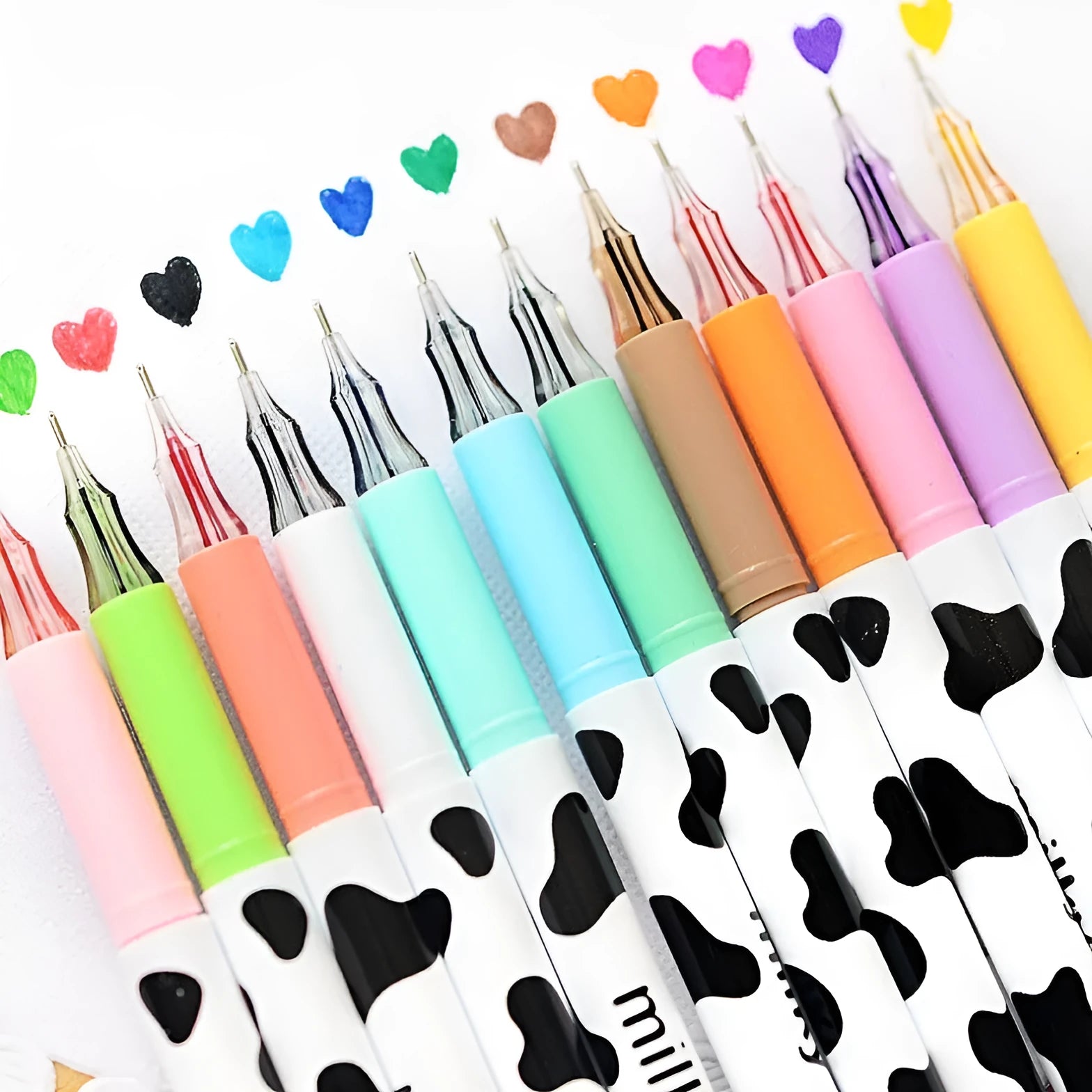 Box of 12 cow print gel pens with 0.38mm fine tips in assorted colours.