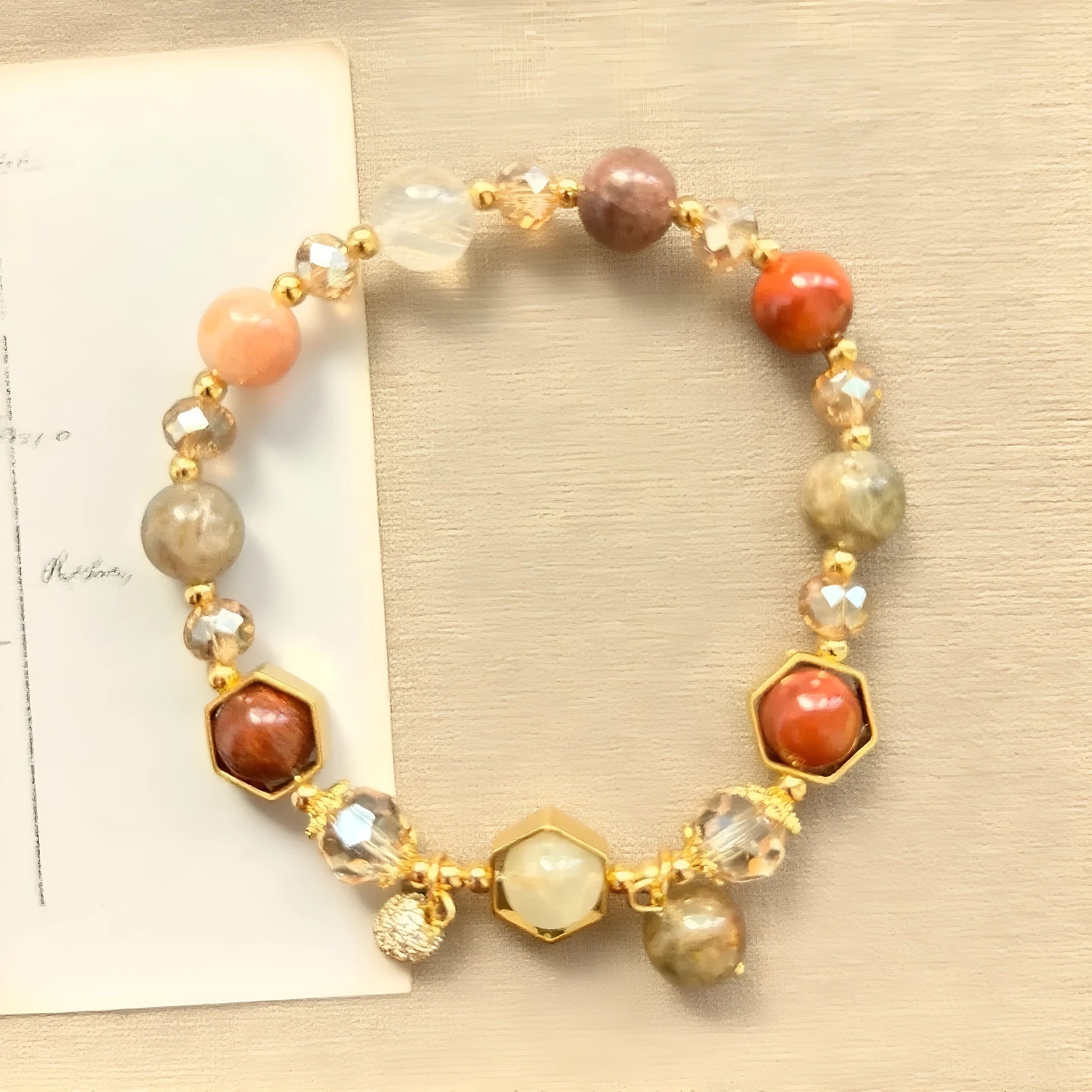 Gold crystal bracelet with 8mm beads showing hand-woven construction and traditional auspicious symbols