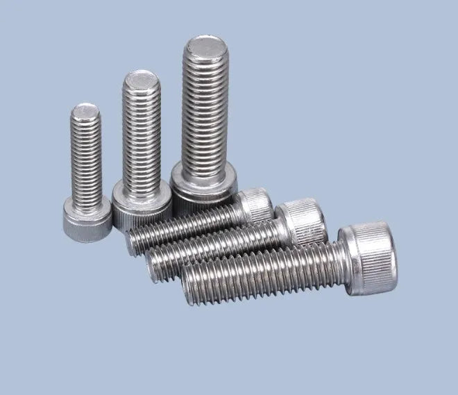 Stainless steel phono cartridge mounting screw set with allen bolts, nuts, washers, and two allen keys on a grey background