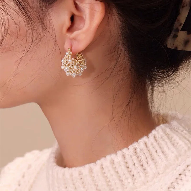 Gold-colour copper flower basket earrings with small beads and pearl inlay decoration