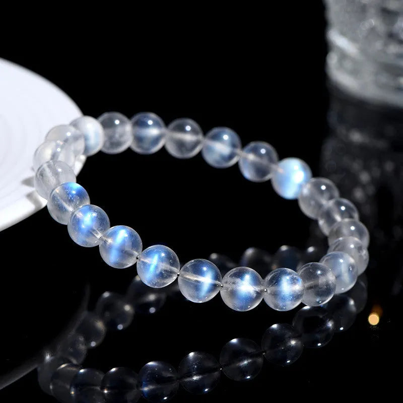 Natural cream body blue moonlight crystal bracelet with grinding finished beads on wrist