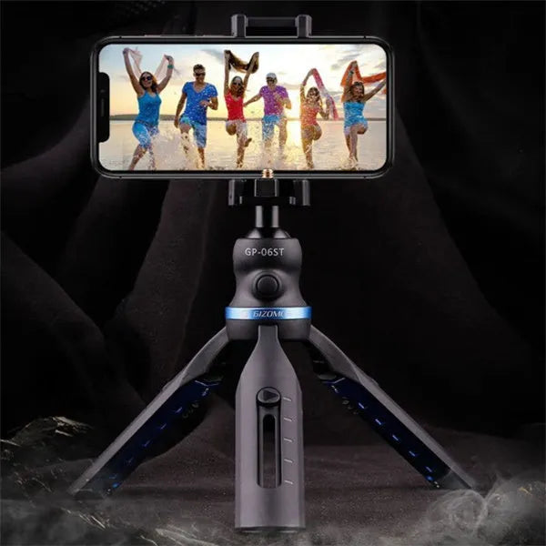 Black desktop mobile phone tripod stand holding a phone, showing adjustable angle bracket.
