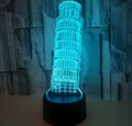 3D acrylic Leaning Tower of Pisa night light glowing in blue on a black base with remote control.