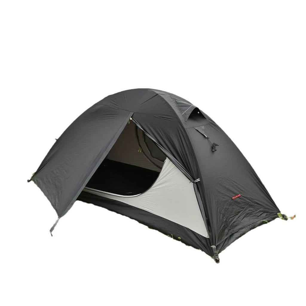 A single person hiking tent with aluminium poles, shown in a black colour option, packed to show its compact size.