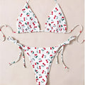 Solid colour halter neck bikini top with backless briefs in nylon.