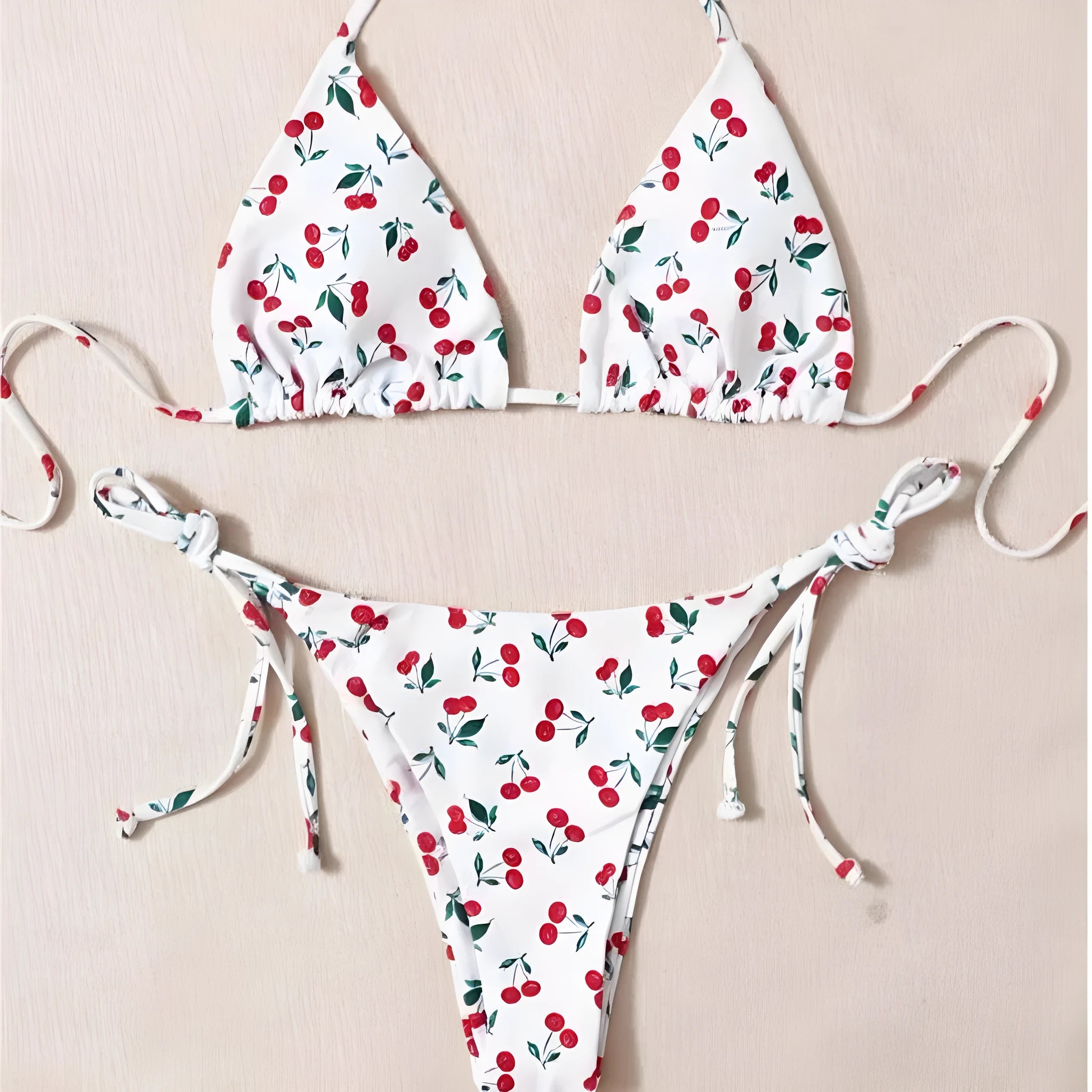 Solid colour halter neck bikini top with backless briefs in nylon.