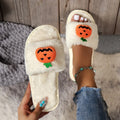 Pumpkin-themed plush slippers with open toe design and anti-slip PVC soles in white and yellow colour options