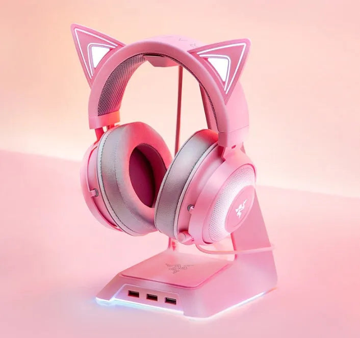 Pink wired USB cat ear headphones with glowing LED lighting on a head-mounted design
