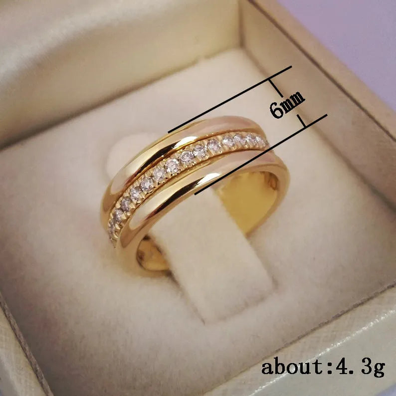 Gold plated geometric rhinestone ring with inlaid stone on white background, size options