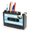 Cassette tape dispenser pen holder in ABS and stainless steel, 17x5x11.5cm, shown in black or blue with small core tape