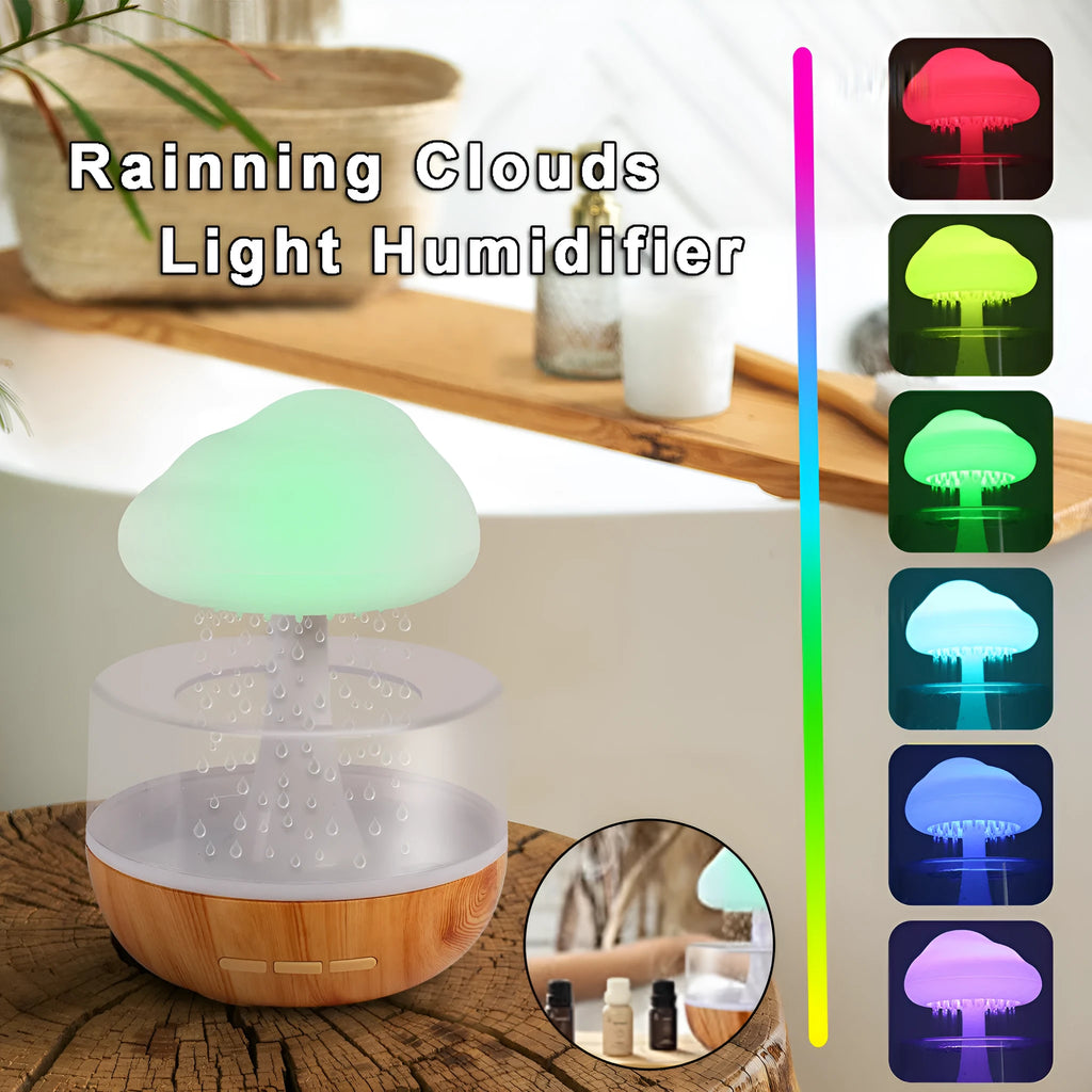 White cloud-shaped humidifier with multi-colour night light on a table.