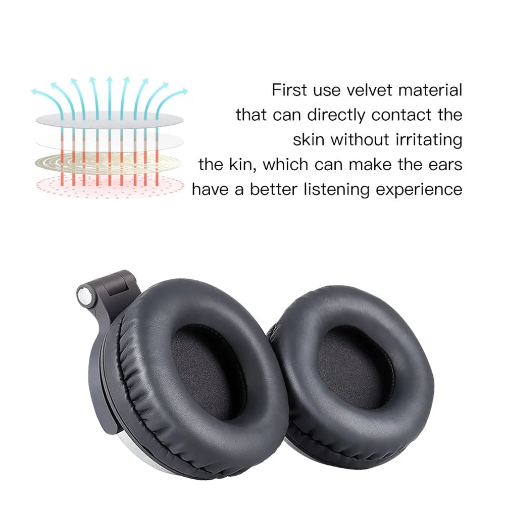 Black and silver folding over-ear headphones with a memory card slot, shown next to a USB charging cable.