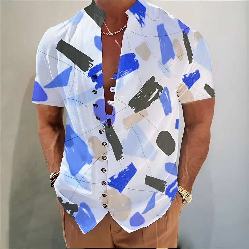 Youth wearing a short sleeve cardigan with a blue and white 3D geometric floral print pattern.