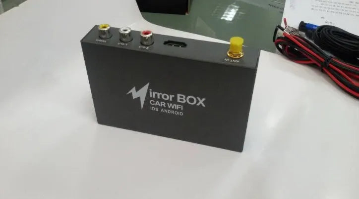 Black car Wi-Fi mirror box with AV converter, power cable, antenna and connection cables for smartphone integration