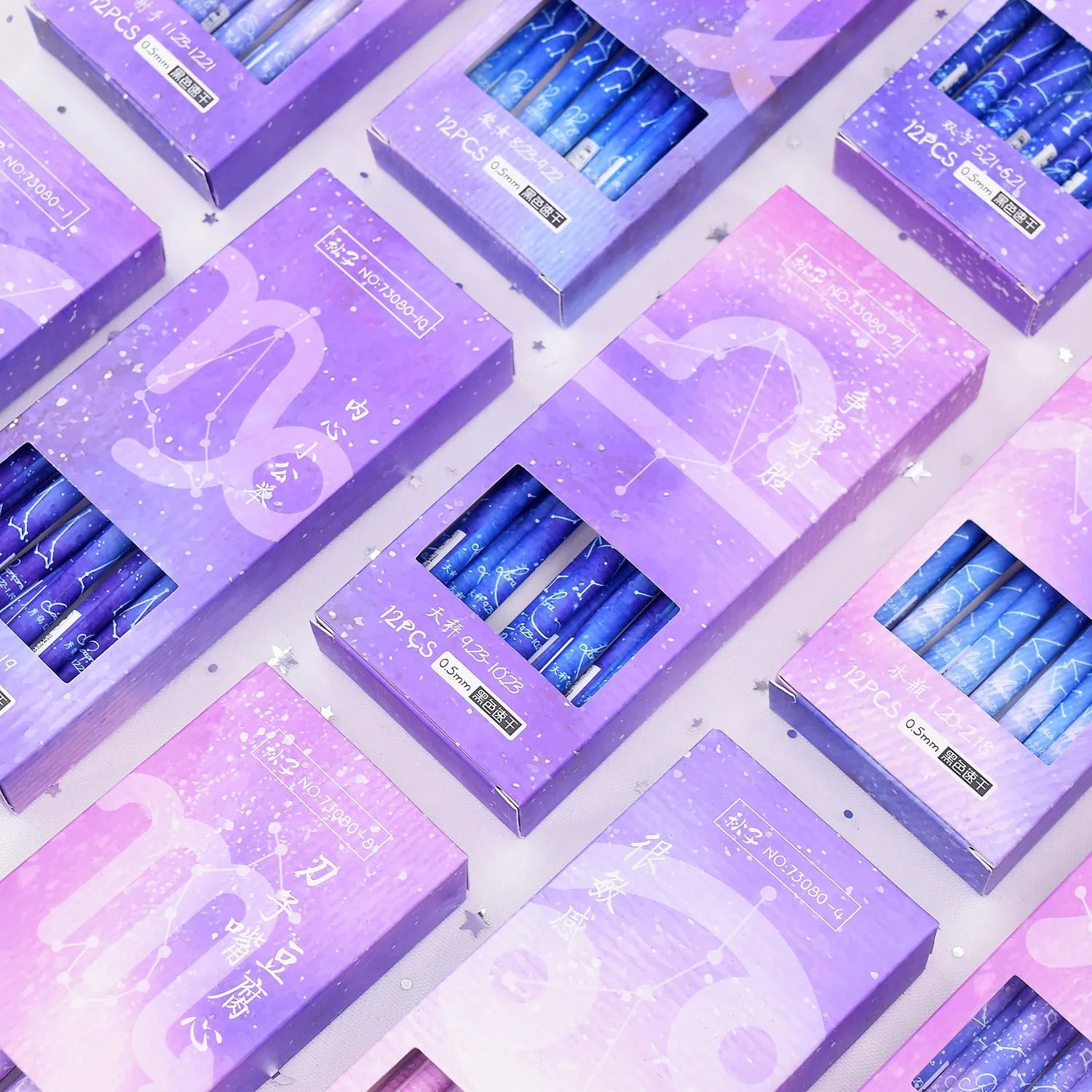 Boxed set of 12 constellation-themed quick-drying gel pens with plastic barrels.