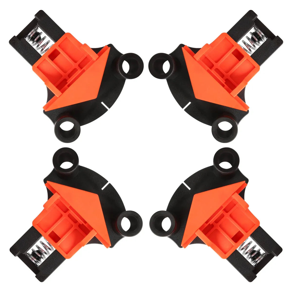 Set of four white plastic 90-degree right-angle clamps for picture frames on a workbench.
