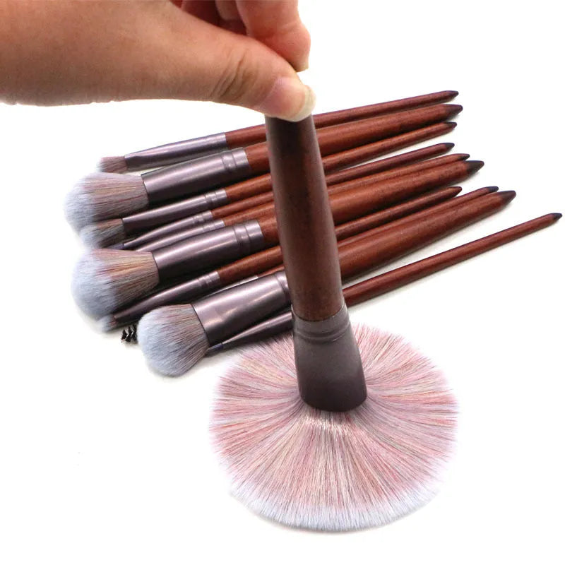 11-piece makeup brush set with synthetic hair heads, matte coffee aluminium ferrules, and natural wood handles