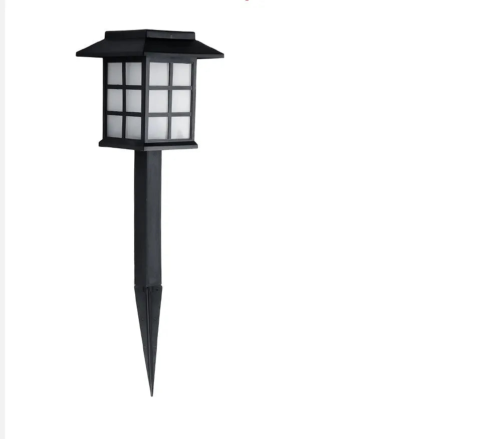 Black solar-powered LED lawn light for outdoor garden and pathway illumination with waterproof construction