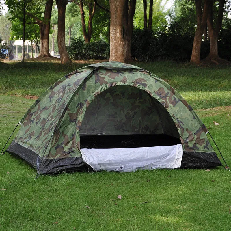 Green and brown camouflage pattern two-person camping tent with mesh windows, shown pitched outdoors.