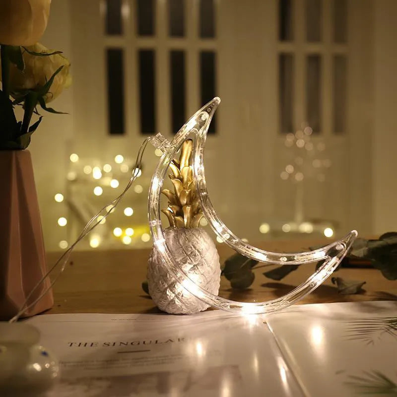Battery-powered LED Christmas chandelier with suction cups, showing Santa Claus and snowman shapes
