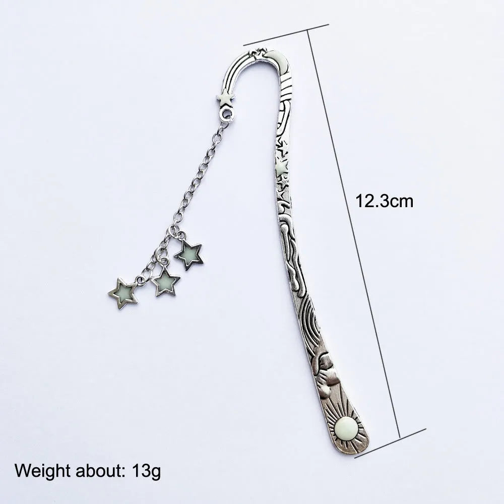Retro five-pointed star glowing metal bookmark in ancient silver and bronze colours with celestial patterns