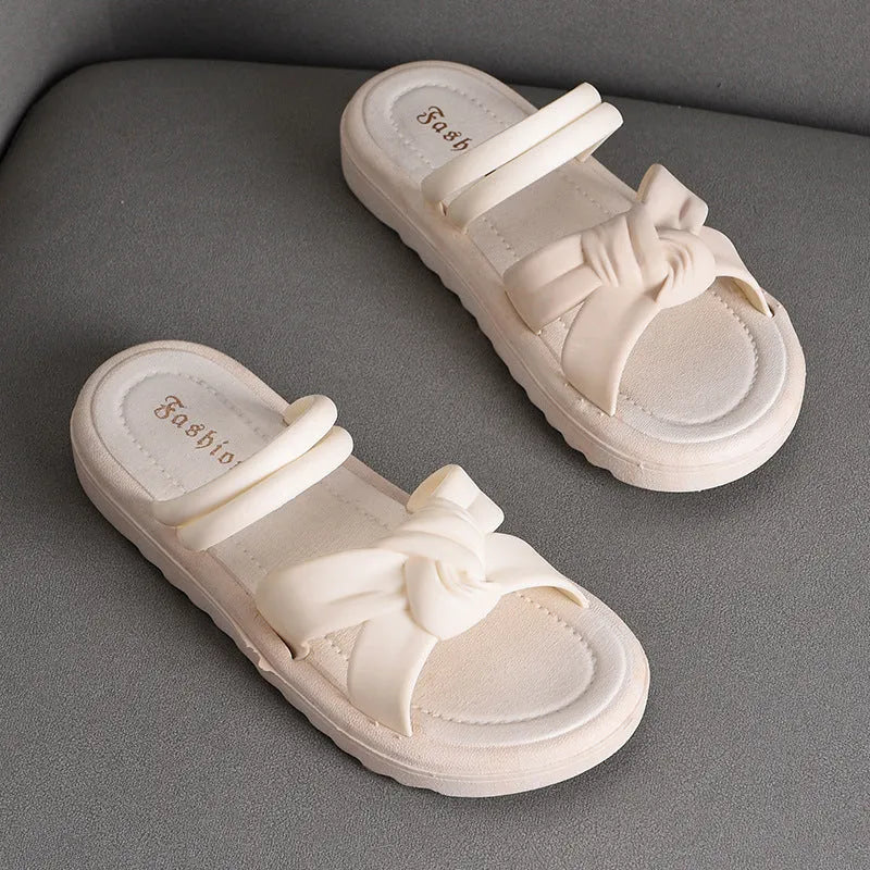 Women's black outdoor sandals with thick soft back and flower detailing on PVC upper