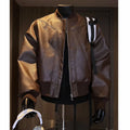 Men's black PU leather jacket with litchi grain texture, shown in a tight-fitting, extended length design.