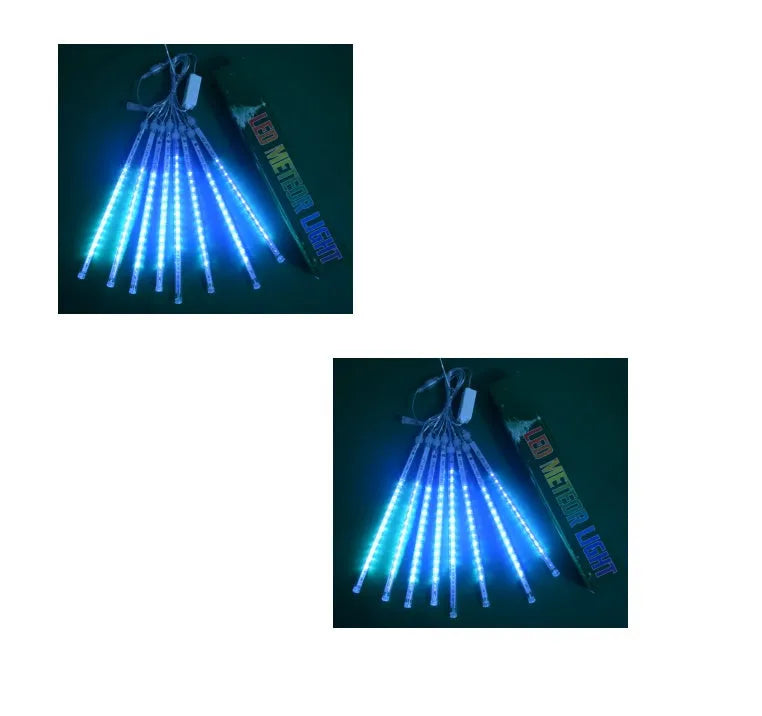 Waterproof LED meteor shower light set with 8 tubes in outdoor garden installation.