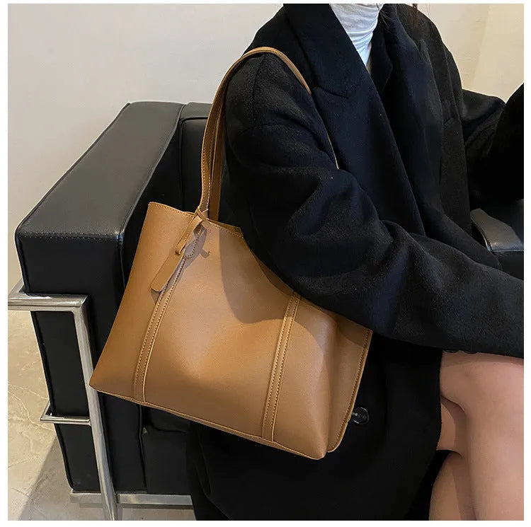 Large capacity soft leather tote bag in beige with synthetic leather lining and double shoulder straps