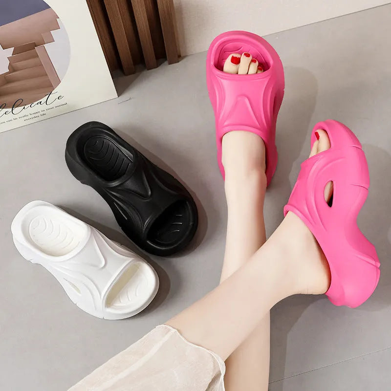 Women's thick-soled EVA beach slippers in rose red colour with round toe design.
