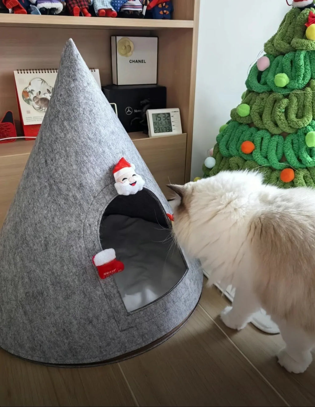 Grey cone-shaped felt cat house with tent-style enclosed design for indoor use