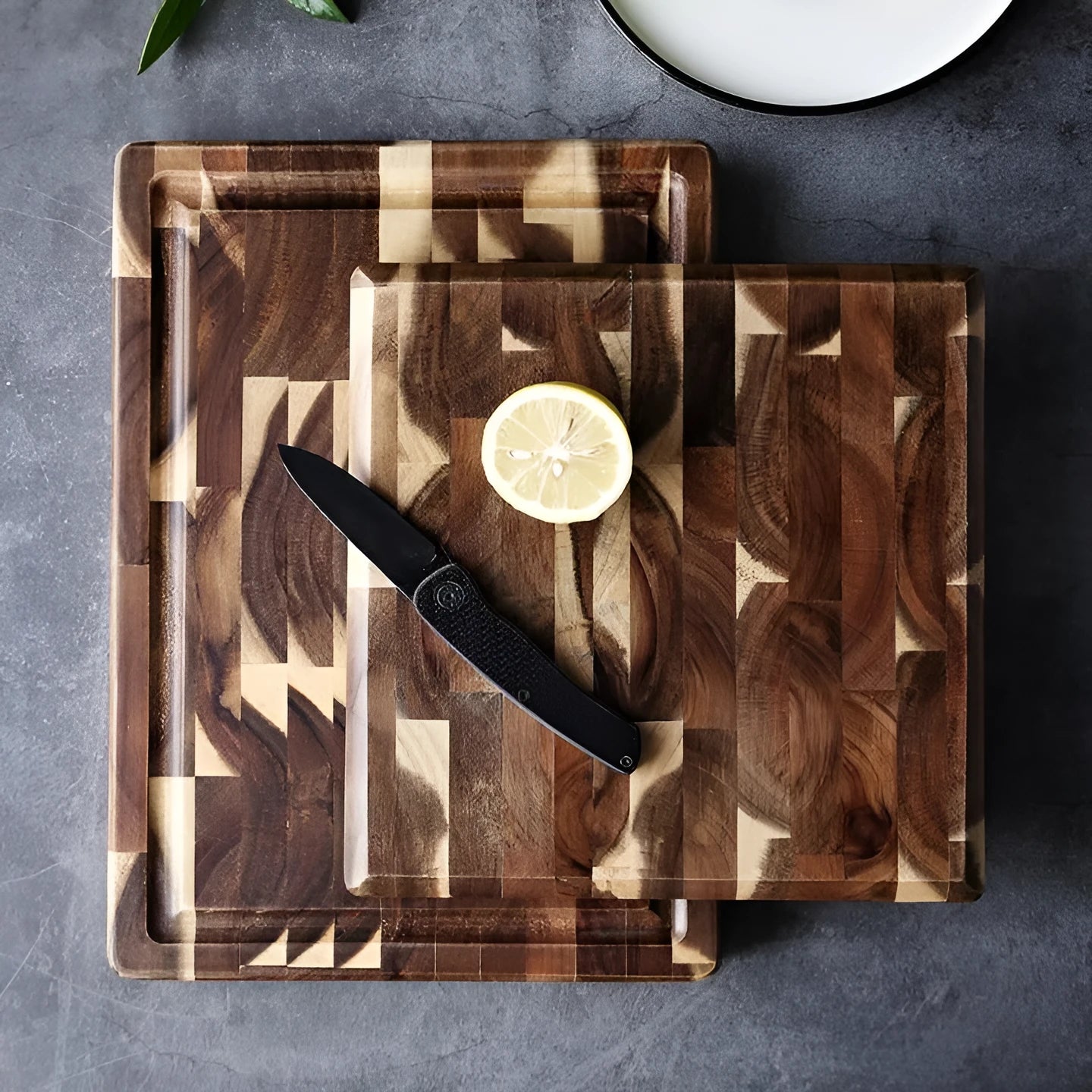 Brown solid wood cutting board with parquet pattern, 3cm thick, on kitchen counter
