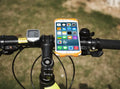 Adjustable silicone bicycle phone holder mounted on handlebar showing three-hole bracket adjustment