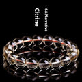 Natural citrine scattered bead bracelet in 7A grade on a wrist, showing polished stones and original design.