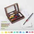 Mini walnut wood watercolour paint box set open showing internal brush and paint compartments.