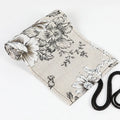 Black Peony printed canvas pencil roll bag unrolled showing 24 holes or 72 holes.
