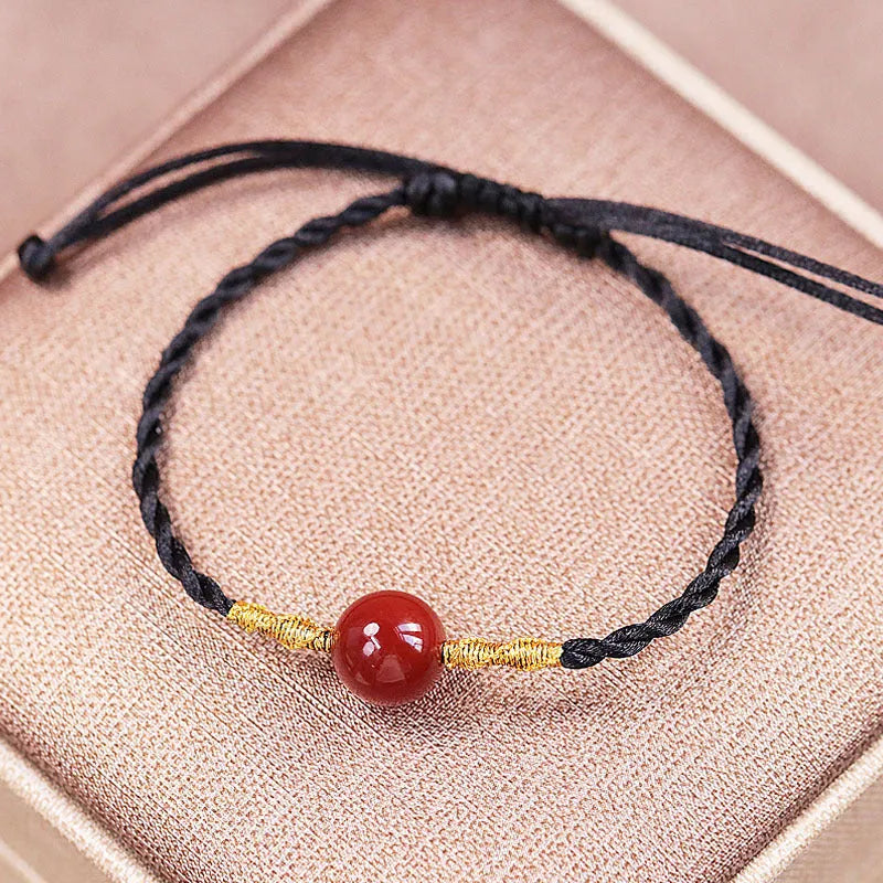 Hand-woven red agate bracelet and necklace set for women in a national style with bead details.