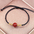 Hand-woven red agate bracelet and necklace set for women in a national style with bead details.