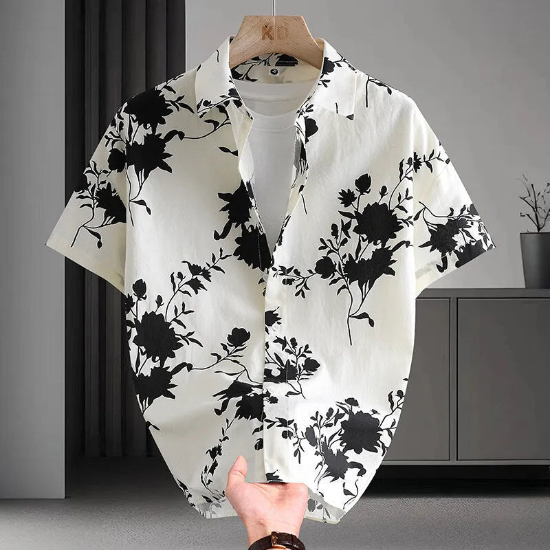 Men's short sleeve cotton shirt with colourful Hawaiian floral print, cardigan style, on a hanger.