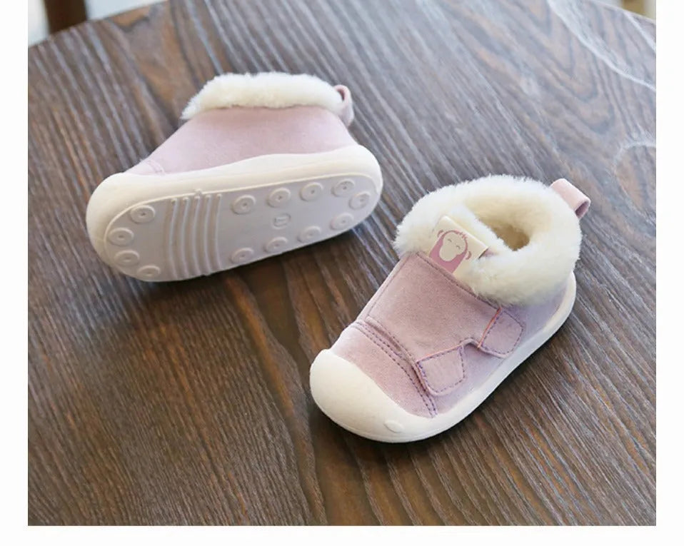 Children's velvet toddler shoes in various colours, showing non-slip sole and soft upper.