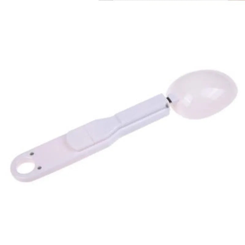White digital spoon kitchen scale with LCD display showing weight measurement