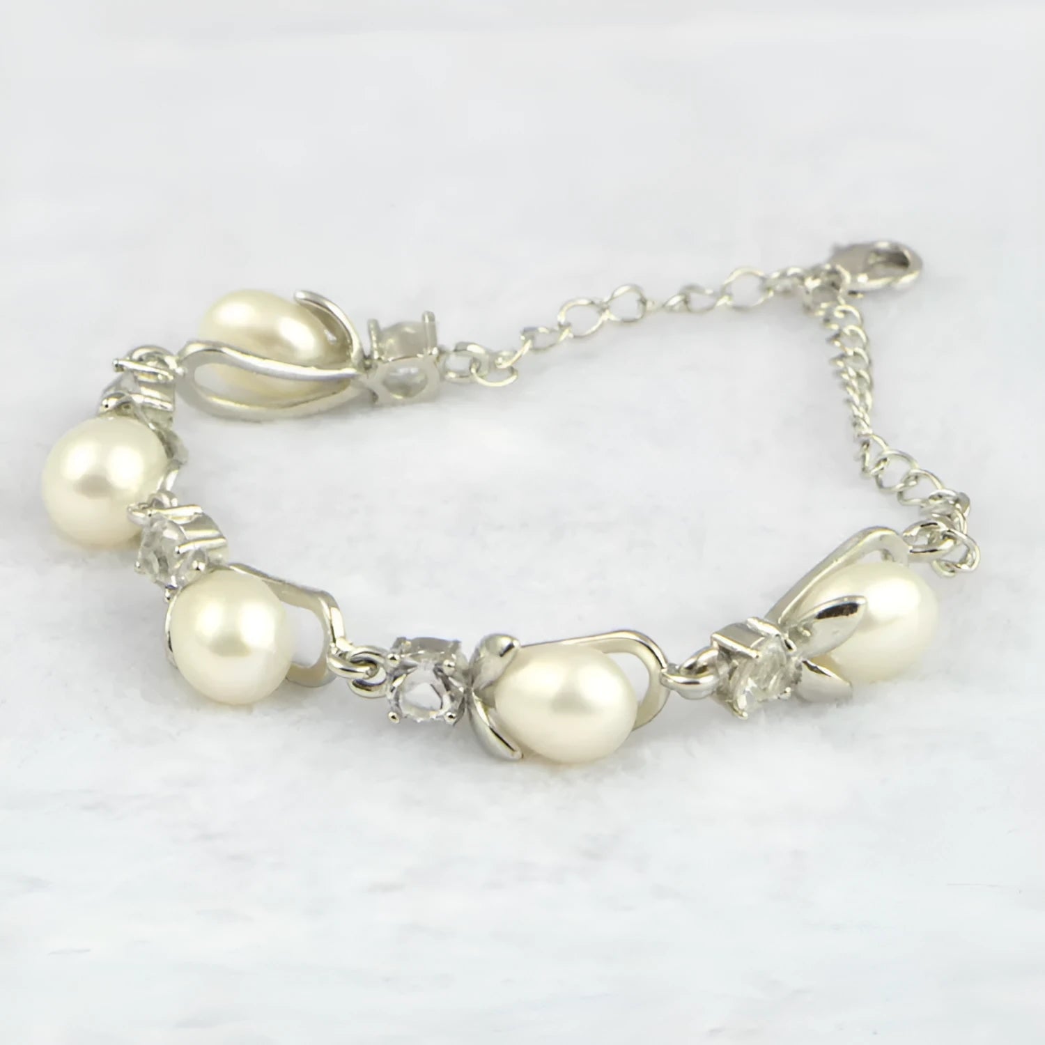 Freshwater pearl bracelet with Korean crown design alloy closure on display