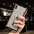 Square clear TPU mobile phone case with a silver flash diamond bracket on a smartphone.