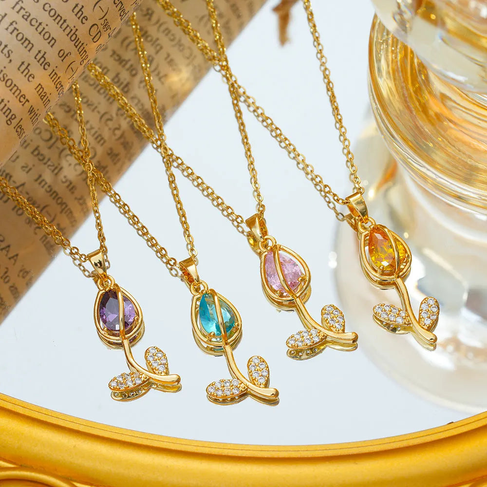 Gold tone zircon tulip pendant necklace on a model, showing the adjustable O-ring chain.