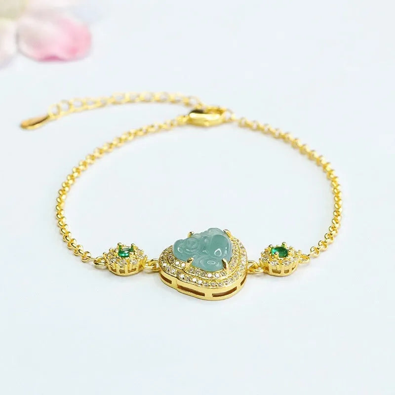 Emerald blue water jade bracelet with inlaid Maitreya Buddha carving, women's jewellery accessory.