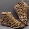 Women's casual flat booties with a wedge heel and round toe in a selection of colours including leopard print.
