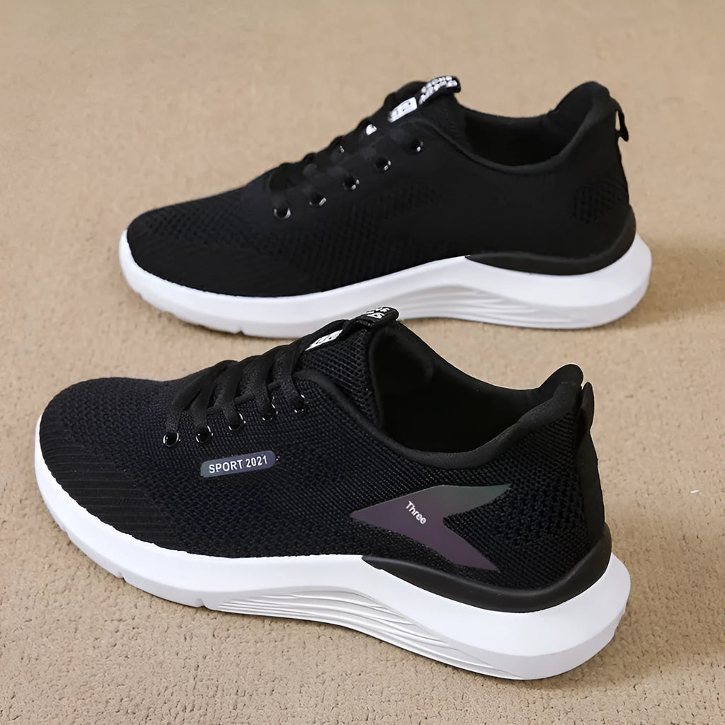 Women's low top casual running shoes in beige with mesh upper, lace-up front, round toe, and soft PVC sole