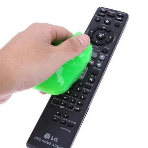 Blue and yellow magic cleaning gel putty for dust removal on a keyboard