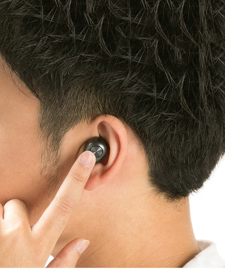 A black wireless Bluetooth single-ear headset for hands-free mobile phone calls.